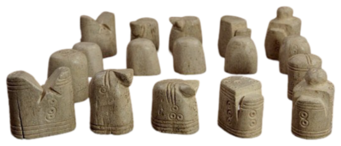 Seventeen stone chessmen in the abstract Persian style.